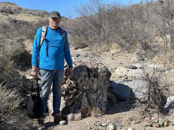 SCRAGS member standing next to unique boulder